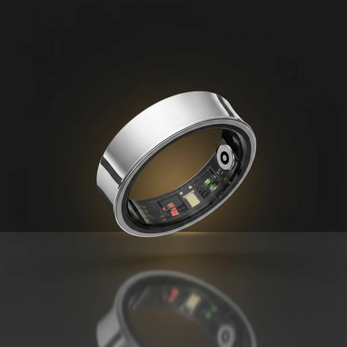 Smart ring with electronic components and a black case on a white background